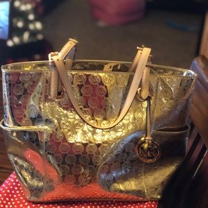Michael Kors Gold Purse, only used once! Silk bag